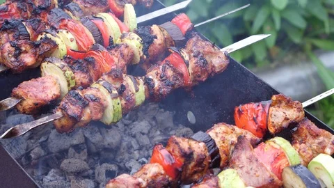 Man cooks meat on the grill Stock Footage 86048397