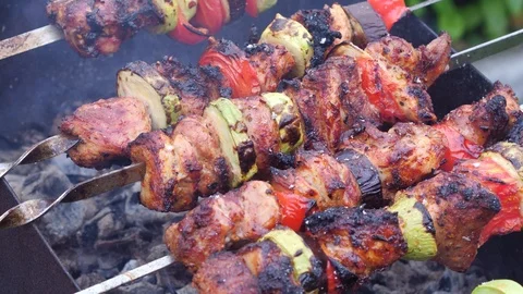 Man cooks meat on the grill Stock Footage 86049853