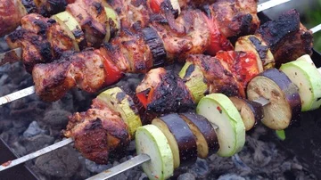 Man cooks meat on the grill Stock Footage 86096227