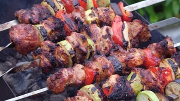 Man cooks meat on the grill Stock Footage 86096576