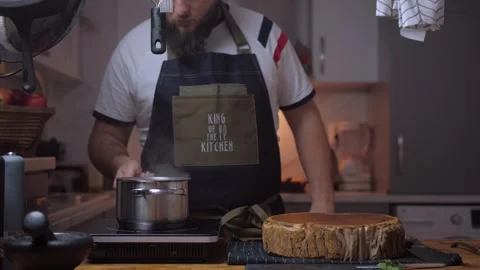A man cooks tuna in a kitchen Stock Footage 258735382