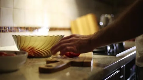 A man cooks a vegetable salad Stock Footage 311022464
