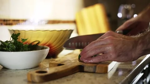 A man cooks a vegetable salad Stock Footage 311022509