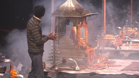 Man with 'cool' beanie walks through Ganga Aarti ceremony in Varanasi, India Stock-Footage 86760502