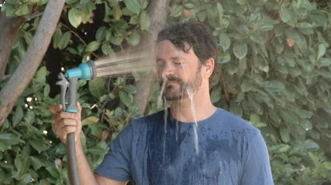 Man Cooling Down On Hot Summer Day 스톡 동영상 66570546