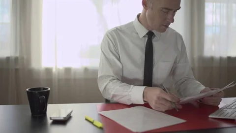 Man copies details from paperwork Stock Footage 71628710