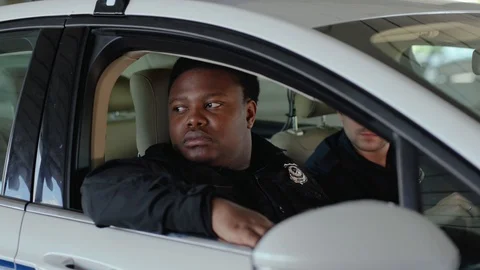 Man cops sitting in patrol car accepting emergence call enforcement talk look at Stock Footage 112954598