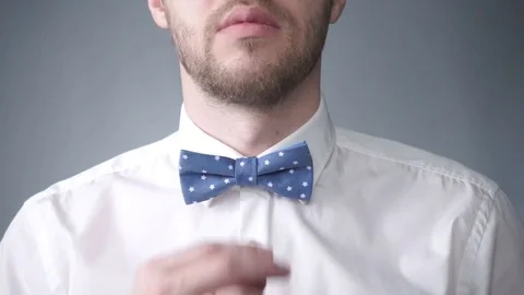 Man Correcting His Bowtie Stock Footage 71374560