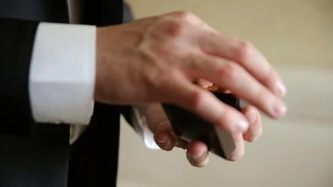 The man corrects the rings in a box Stock Footage 85263043