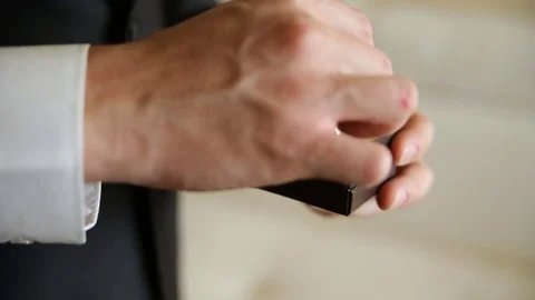 The man corrects the rings in a box Stock Footage 85263782