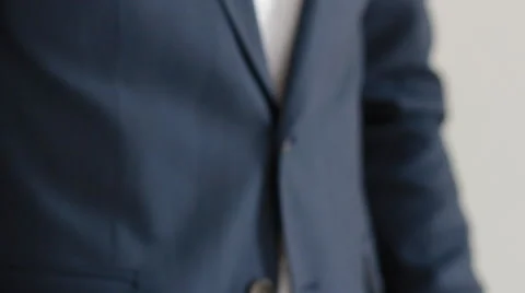 Man corrects shirt cuff Stock Footage 63130874