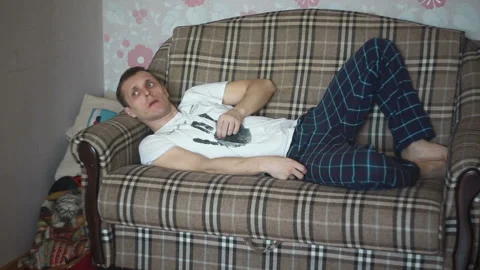 Man on the couch Stock Footage 87299145