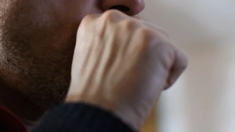 Man coughing at home Stock Footage 125718758