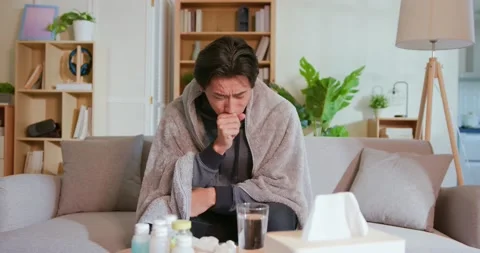 Man coughs at home Stock Footage 160920698