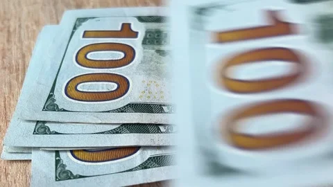 Man count paper one hundred dollars USA on wood table Stock Footage 307079491