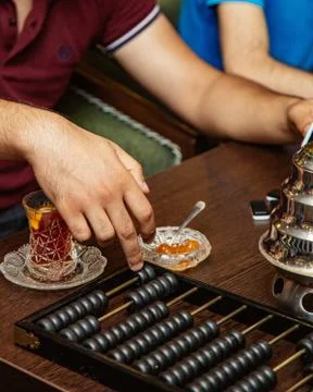 Man counting in abacus counting machine at the tea house Stock Photos