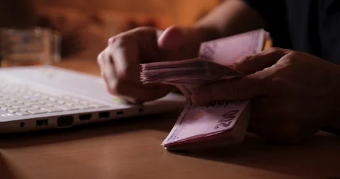 Man Counting Banknotes at Computer in the Evening, Finance and Home Office Conce Video stock 328095201