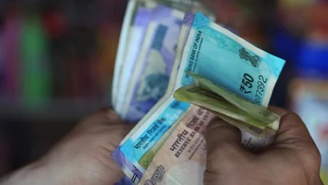 Man Counting a Bundle of Indian Currency Stock Footage 274466128