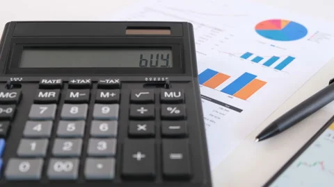 Man Counting on Calculator and Showing Buy on Screen. Close-up Shot Video stock 150090960