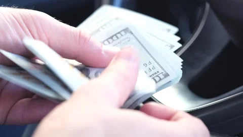Man is counting cash in a car. Count dollar money 10.09.2023 - Minsk, Belarus Video stock 252447503
