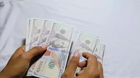 Man counting dollar bill salary Stock Footage 285571689