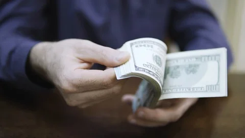 Man counting dollar bills. Close up of male hands count money cash Stock Footage 123153277