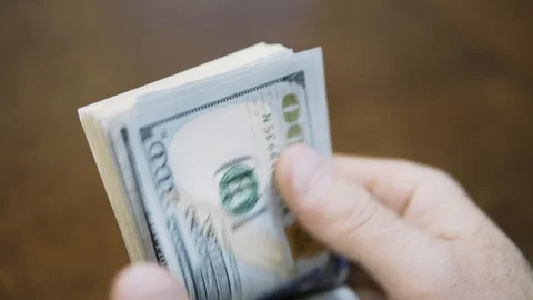 Man counting dollar bills. Close up of male hands count money cash Stock Footage 123153448