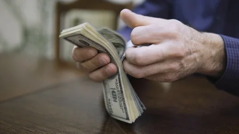 Man counting dollar bills. Close up of male hands count money cash Stock-Footage 123153500