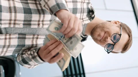 Man counting dollar bills near the car. Close up of male hands count money cash Stock-Footage 241420144