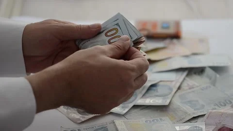 The man is counting dollar. Close up of hands. Stock Footage 133383054