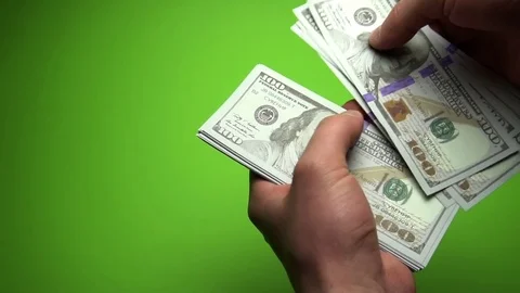Man Counting Dollar Notes isolated on green screen. Close up. Slow motion 120fps Stock Footage 85394964