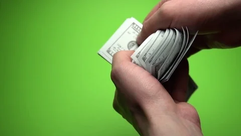 Man Counting Dollar Notes isolated on green screen. Close up. Slow motion 120fps Stock Footage 85395077