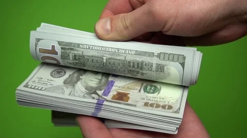 Man Counting Dollar Notes isolated on green screen. Close up. Slow motion 120fps Stock Footage 85395516