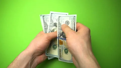 Man Counting Dollar Notes isolated on green screen background. Close up. Stock Footage 86439927
