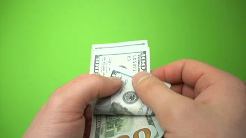 Man Counting Dollar Notes isolated on green screen background. Close up. Stock Footage 86440429