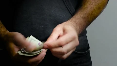 Man counting dollars banknotes. Selective focus of a man with American money Stock Footage 201529851