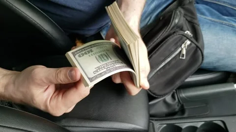 Man counting dollars in the car № 5 Stock Footage 242264696