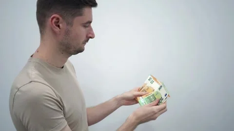 Man counting Euro banknotes of various denominations. Business and finance Stock Footage 286906341