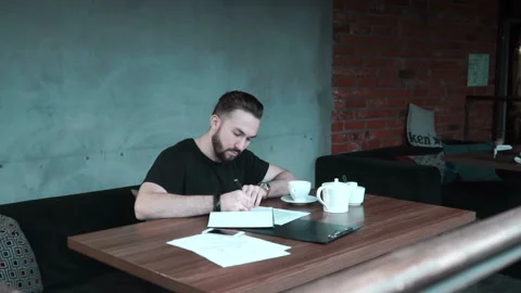 Man is counting up his expenses Stock Footage 86246130