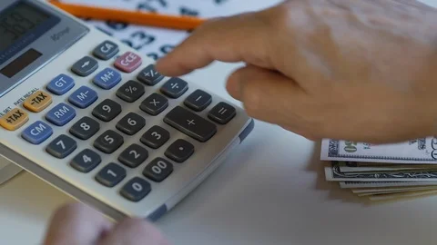 Man Is Counting Money And Using Calculator 스톡 동영상 100326464