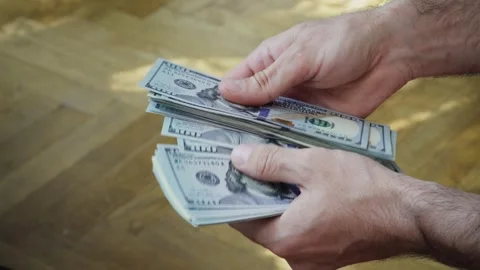 Man counting money. to count dollars Stock Footage 299002738
