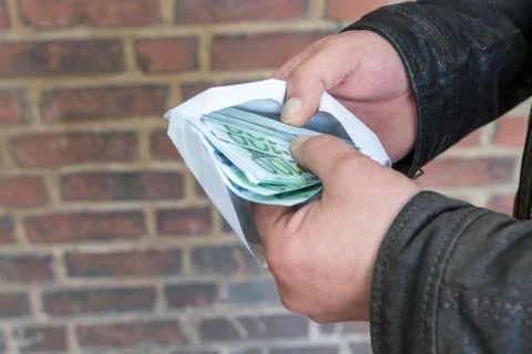 Man is counting money in an envelope Stock Photos
