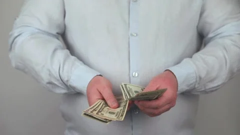 Man counting money in hands Stock Footage 225626964