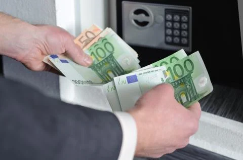 Man is counting money. Stock Photos