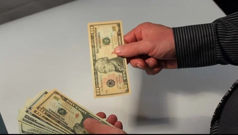 Man counting money (US dollars) Stock Footage 6930320