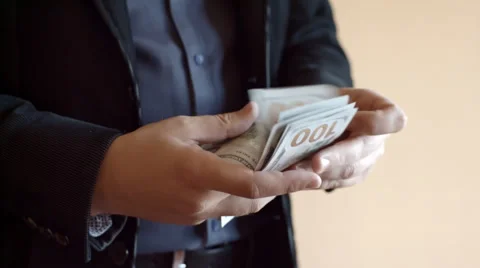 Man Counting One Hundred US Dollar Banknotes Stock Footage 69066055