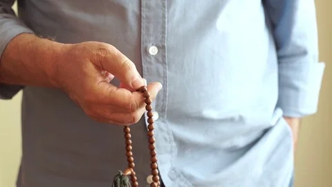 Man Counting Prayer Beads Video stock 81948469