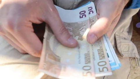 A man counting stack of euro bills Stock Footage 79787627