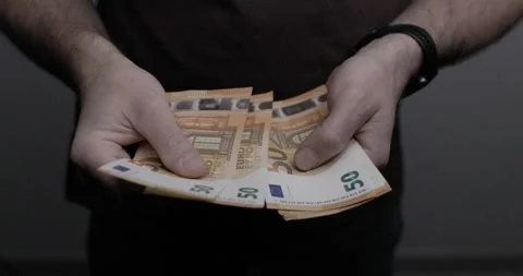 Man is counting a stack of fifty euro banknotes 動画素材 285057529
