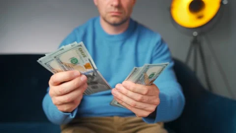 Man counting US Dollar bills or paying in cash. Concept of investment, success Stock-Footage 201263793